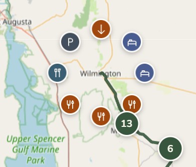 Route and amenities map showing amenity icons and a green cluster badge with the number 13